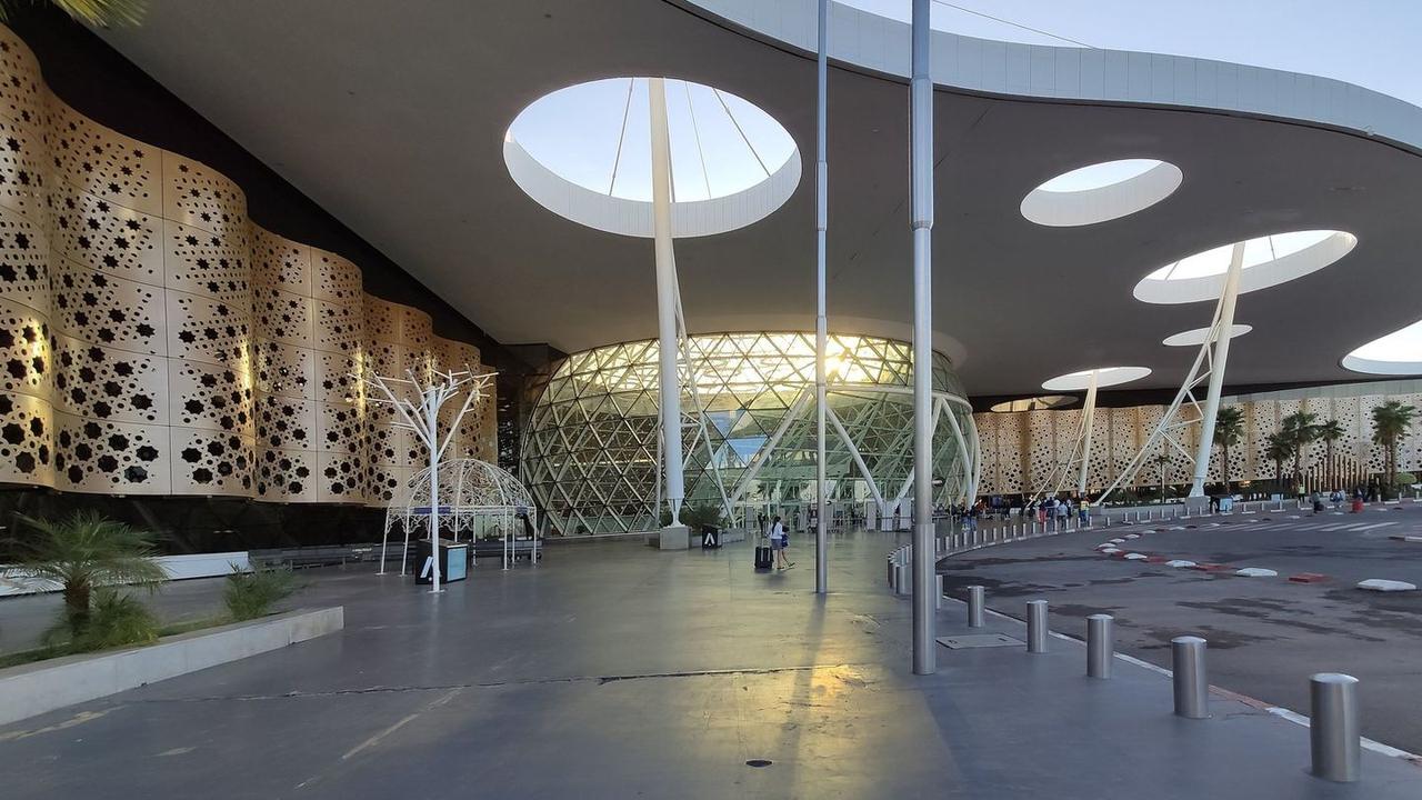Travelers arriving at Marrakech Airport and planning the transfer into the city center
