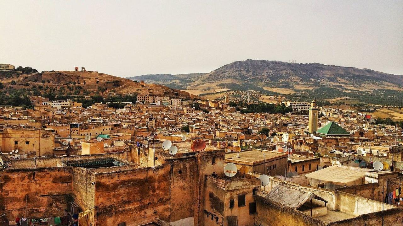 Travelers planning how to get to Fes by bus